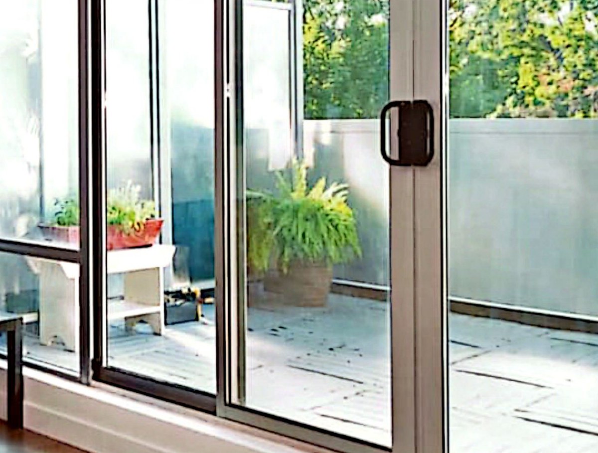 Modern home at dusk glowing through large uPVC windows